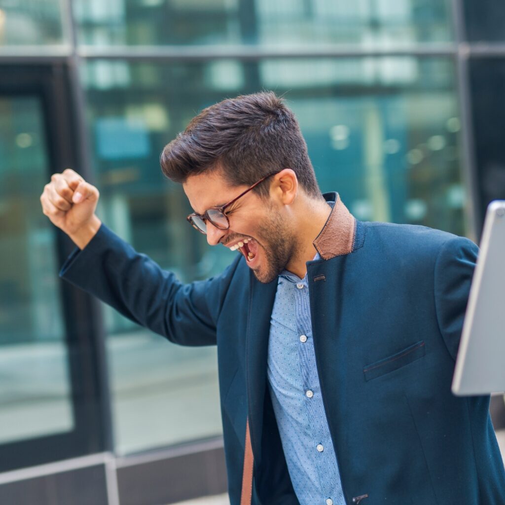 Man in suit shaking fist